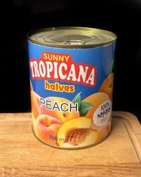 Персики половинки 850 г " Tropicana"